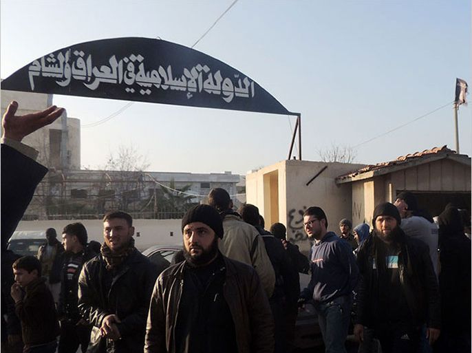 People demonstrate outside the offices of the Al-Qaeda-linked Islamic State of Iraq and the Levant (ISIL) demanding that they stop fighting with the rebels on January 6, 2014 in the northern Syrian city of Aleppo. Syrian rebels have united