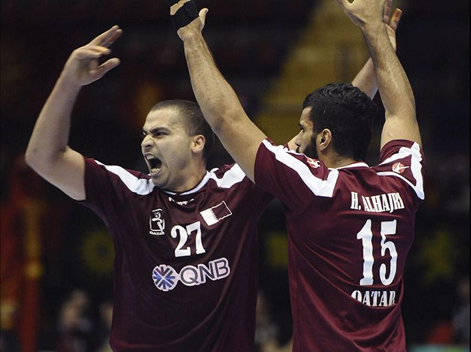 epa03534164 Qatar players Mahmoud Osman (L) and Hamad Alhajri celebrate a goal during their men's Handball World Championship Group B preliminary round match against the Former Yugoslavian Republic of Macedonia (FYROM) at San Pablo sports pavilion in Seville, southern Spain, 13 January 2013