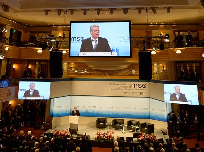 German President Joachim Gauck is displayed on giant screens as he speaks during the opening of the 50th Munich Security Conference on January 31, 2014 in Munich, southern Germany. Gauck opened the meeting with an appeal for his country to play a greater role on the world stage and in tackling global trouble spots. The annual meeting of the global "strategic community" was set to deal with thorny international issues, from the Syrian war and Ukraine's turmoil to Iran's nuclear programme and US online surveillance. AFP PHOTO / CHRISTOF STACHE
