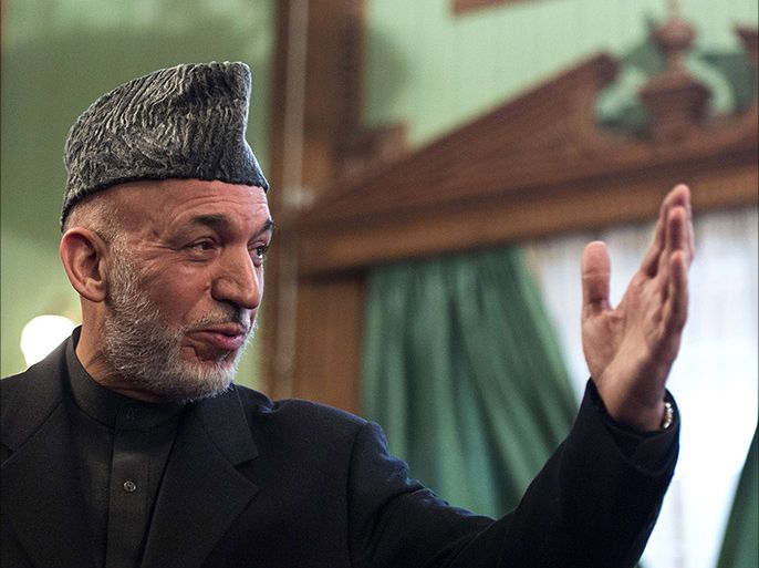 Afghan President Hamid Karzai gestures during a press conference at the Presidential Palace in Kabul on January 25, 2014. President Hamid Karzai on
