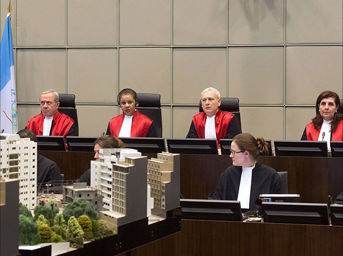 (L-R) Judges Walid Akoum, Janet Nosworthy, David Re, Micheline Braidy and Nicola Lettier preside over the first hearing in the trial of four people accused of murdering former Lebanese premier Rafiq Hariri at the Special Tribunal for Lebanon in The Hague on January 16, 2014. Four Hezbollah members went on trial in absentia at a UN-backed tribunal accused of murdering Hariri in a 2005 car bombing, with sectarian tensions running high at home. AFP PHOTO/POOL/TOUSSAINT