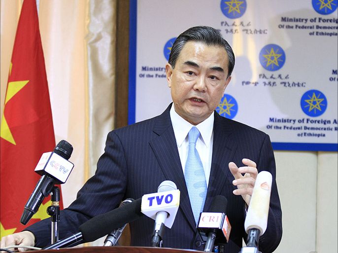 China's Foreign Minister Wang Yi gives a press conference on January 6, 2014 in Addis Ababa with Ethiopian counterpart, Tedros Adhanom (unseen). Peace talks between South Sudan's government and rebels started in Ethiopia on Monday, as key power China added its weight to efforts to end weeks of fighting in the world's youngest nation. Sudan meanwhile said that it and South Sudan had agreed during a visit to Juba by Sudanese President Omar al-Bashir to consider setting up a joint force to protect vital oilfields. AFP PHOTO/Solan GIMECHU
