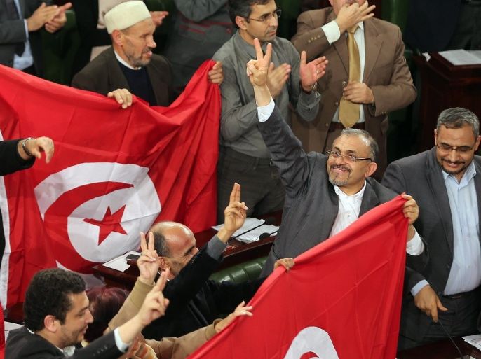 Members of the Tunisian National Constituent Assembly (NCA) celebrates after the adoption of a new constitution in Tunis, Tunisia, 26 January 2014. The NCA passed the nation's new democratic constitution with 200 votes out of 216, with two against and four abstentions.