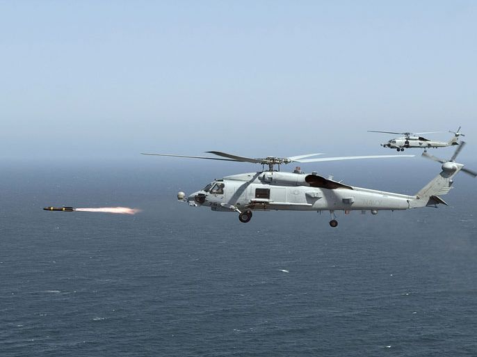 This April 23, 2008 US Navy photo shows an MH-60R Seahawk firing a Hellfire missile during training near San Diego, California. The United States will speed up delivery of missiles and surveillance drones to Iraq as the Baghdad government battles a resurgence of Al-Qaeda linked militants, a Pentagon spokesman said January 6, 2014. "We are ... looking to accelerate the FMS (Foreign Military Sales) deliveries with an additional 100 Hellfire missiles ready for delivery this spring," Colonel Steven Warren said. An additional 10 ScanEagle surveillance drones would also be delivered he said. Hellfire missiles, originally designed as an anti-tank weapon, can be fired from helicopters or airplanes. ScanEagle drones are a low-cost three-meter aircraft capable of flying 24 hours. AFP PHOTO / Handout / US Navy / MC2 Mark A. Leonesio == RESTRICTED TO EDITORIAL USE / MANDATORY CREDIT: "AFP