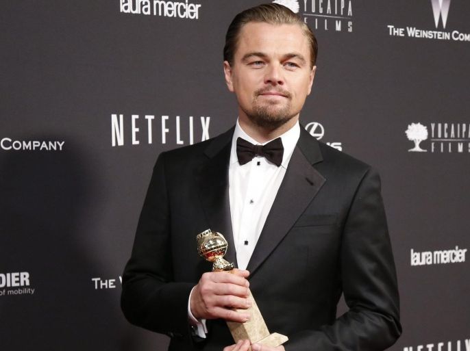 Actor Leonardo DiCaprio poses with the award for Best Actor in a Motion Picture, Musical or Comedy for his role in "The Wolf of Wall Street" at The Weinstein Company & Netflix after party after the 71st annual Golden Globe Awards in Beverly Hills, California January 12, 2014. REUTERS/Danny Moloshok (UNITED STATES - Tags: Entertainment)(GOLDENGLOBES-PARTIES)