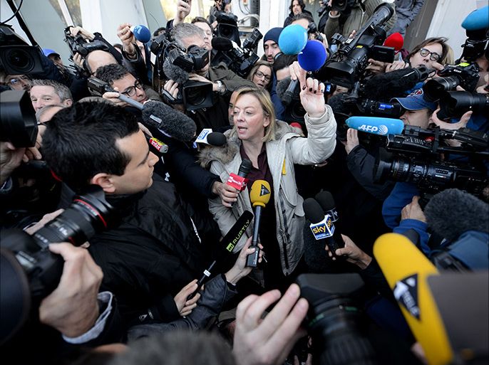 TOPSHOTSMichael Schmacher's manager, Sabine Khem, speaks to journalists in front of the Grenoble CHU hospital on January 1st, 2014 where the Formula One legend spent a third night in hospital in an induced coma after an off-piste skiing accident in