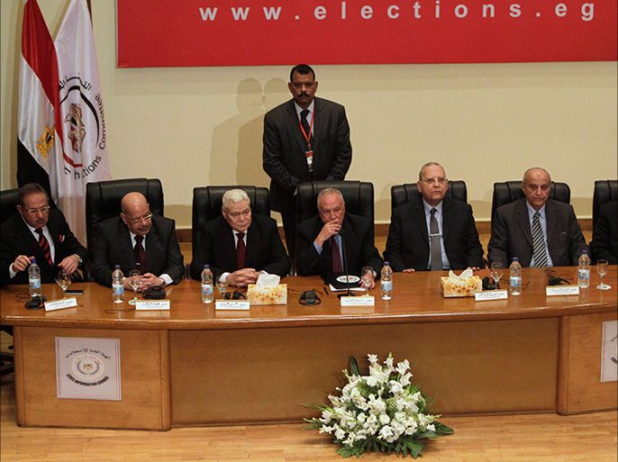 Nabil Salib (C), head of the Supreme Election Committee, holds a news conference announcing a new constitution in Cairo January 18, 2014. More than 98 percent of voters backed the new Egyptian constitution in a