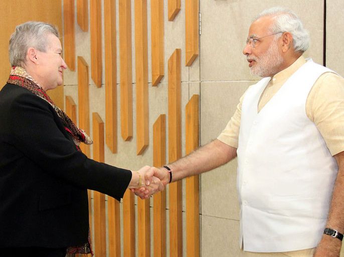 epa04073363 A handout photo provided by the Gujarat Government on 13 February 2014 showing US Ambassador to India Nancy Powell (L) shake hands with Chief minister of the western state of Gujarat and Bhartya Janta Party's prime ministerial candidate Narendra Modi (R) in Gandhinagar, Gujarat, India, 13 February 2014. Ending Washington's nine-year boycott of him over religious violence in 2002, Nancy Powell met Hindu nationalist leader Modi and discussed the importance of the US-India relationship, regional security issues, human rights and American trade and investment in India', released statement said. EPA/GUJARAT GOVERNMENT / HANDOUT HANDOUT EDITORIAL USE ONLY/NO SALES