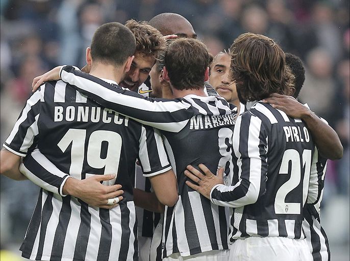 Juventus' Spanish forward Fernando Llorente (2ndL-back) celebrates with teammates after scoring a goal during the Italian Serie A football match Juventus vs Chievo Verona at the Juventus Stadium in Turin on February 16, 2014