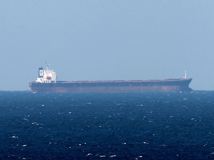 epa03060774 An Oil tanker is seen in the Strait of Hormuz from Khasab, Oman on 15 January 2012. Tehran has warned oil-producing Arab countries in the Persian Gulf against replacing Iranian oil if Western sanctions against it are implemented, a newspaper reported 15 January. Iranian generals have warned