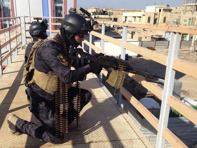 Iraqi security forces take part in clashes with al Qaeda-linked Islamic State in Iraq and the Levant (ISIL) in the city of Ramadi, 100 km (62 miles) west of Baghdad, February 9, 2014. ISIL militants and other Sunni groups angered by the Shi'ite-led government overran Falluja and parts of the nearby city of Ramadi in the western province of Anbar on Jan. 1. Picture taken February 9, 2014. REUTERS/Stringer (IRAQ - Tags: CIVIL UNREST POLITICS MILITARY)
