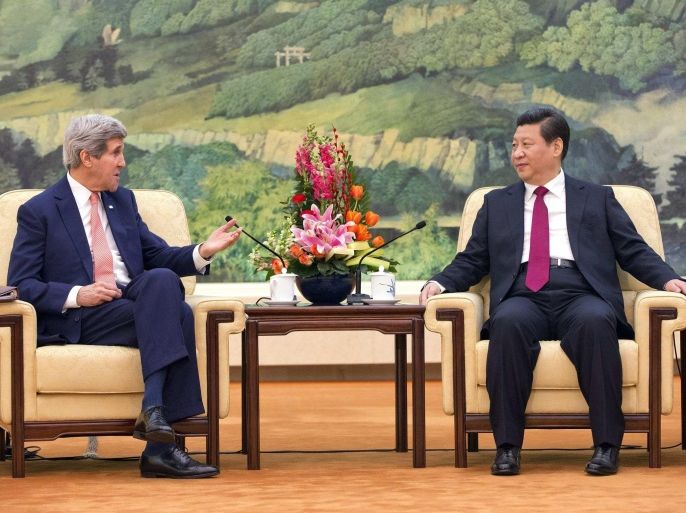 U.S. Secretary of State John Kerry (L) meets with Chinese President Xi Jinping at the Great Hall of the People in Beijing February 14, 2014. REUTERS/Evan Vucci/Pool (CHINA - Tags: POLITICS)