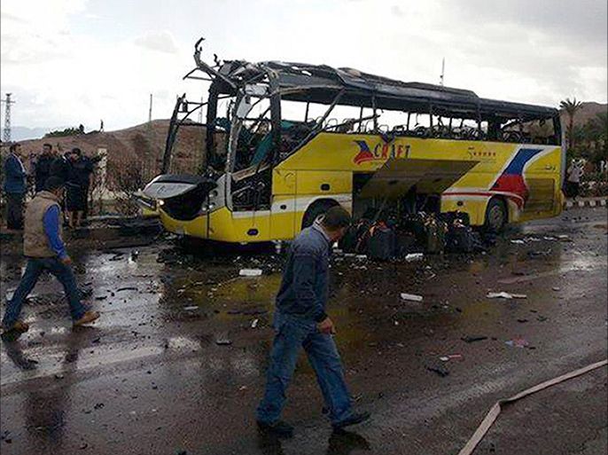 A picture taken on February 16, 2014 show the wreckage of a tourist bus at the site of a bomb explosion in the Egyptian south Sinai resort town of Taba. A bomb tore through a bus carrying sightseers near an Egyptian resort town bordering Israel, police officials said. AFP PHOTO / STR
