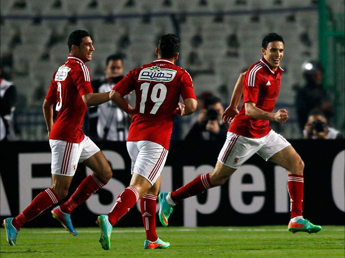 Mohamed Nagi "Gedo" (2nd R) of Egypt's Al-Ahly celebrates after scoring against Tunisia's CS Sfaxien during their African Super Cup soccer match at Cairo Stadium February 20, 2014. REUTERS/Amr Abdallah Dalsh (EGYPT - Tags: SPORT SOCCER)