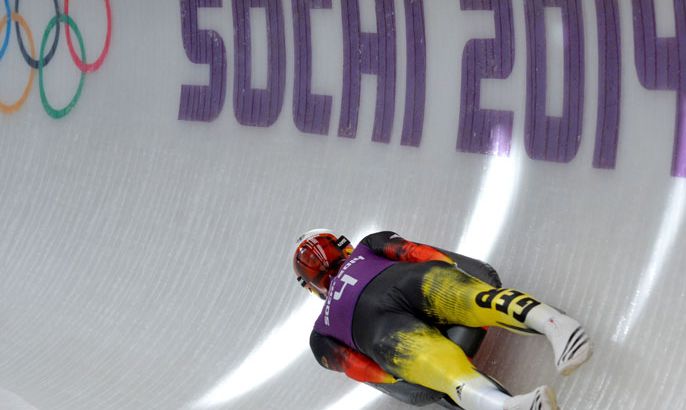 RIX308 - Rosa Khutor, -, RUSSIAN FEDERATION : Germany's Felix Loch races during a Luge training session at the Sanki Sliding Centre in Rosa Khutor on February 7, 2014. AFP PHOTO/Leon Neal
