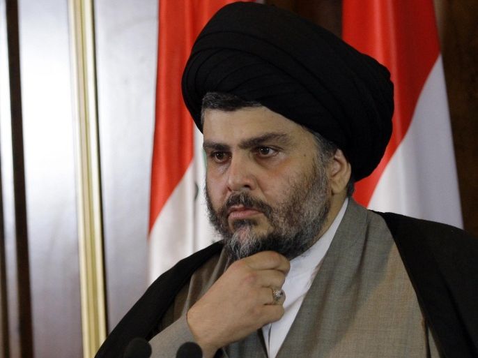 FILE - In this April 26, 2012, file photo, Shiite cleric Muqtada al-Sadr looks on during a press conference in Irbil, Iraq. One of Iraq's most influential Shiite clerics, Sadr, said he has decided to quit politics, distancing himself from any political movement that uses his name. (AP Photo/Khalid Mohammed, File)