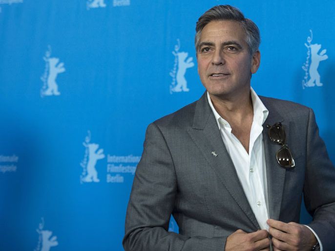 EIS01 - Berlin, Berlin, GERMANY : US actor and director George Clooney poses during a photocall for the film The Monuments Men at the 64th Berlinale Film Festival in Berlin, on February 8, 2014. The 64th Berlinale, the first major European film festival of the year, starts with 24 international productions screening in the main showcase. AFP PHOTO / JOHANNES EISELE