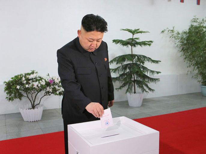 epaselect epa04118080 A picture released by the North Korea Central News Agency (KCNA) on 10 March 2014 shows North Korean leader Kim Jong-un casting a ballot at a polling station at the Kim Il-sung University of Politics in Pyongyang, North Korea, 09 March 2014, to elect the Supreme People's Assembly. It is the first election for the North's rubber-stamp parliament since Kim took over power in December 2011 after the death of his father Kim Jong-il. The election is held every five years. EPA/KCNA SOUTH KOREA OUT