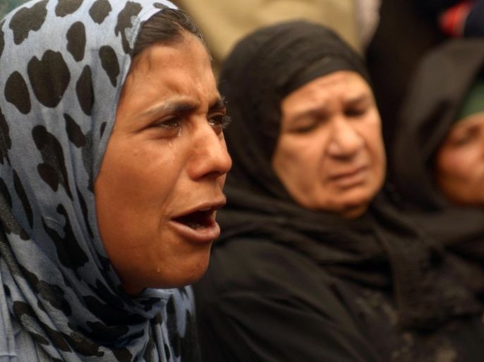 A relative of a supporter of Egyptian ousted Islamist president Mohamed Morsi cries outside the courthouse on March 25, 2014 in the central Egyptian city of Minya, during a session of the trial of some 700 Islamists charged with deadly rioting in an Egypt city. The court that the day before sentenced to death 529 alleged supporters of Morsi will sentence nearly 700 more on April 28, a lawyer said, after the hearing was adjourned. AFP PHOTO / STR