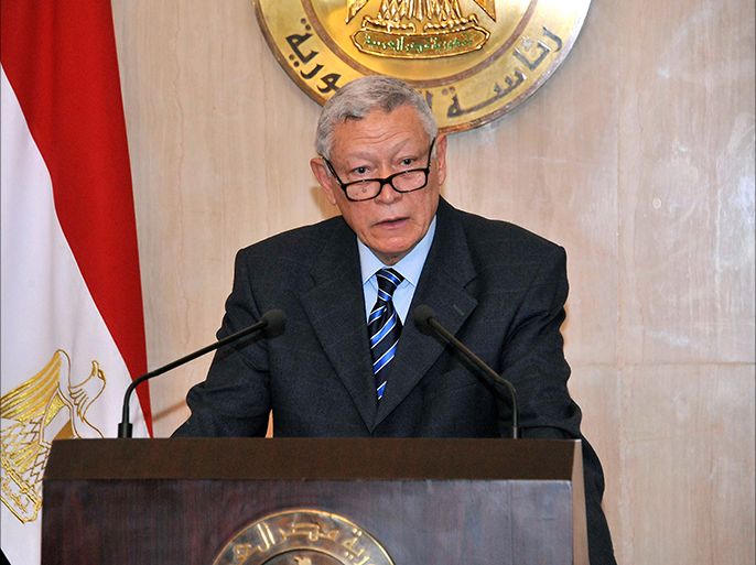 A handout picture made available by the Egyptian presidency on March 8, 2014 shows presidential adviser for constitutional matters Ali Awad, speaking duirng a press conference in the capital Cairo after the interim Egyptian president promulgated a law setting the stage for an election later this year. The election is seen as a major step in a roadmap outlined by the interim authorities after the military deposed Morsi in July