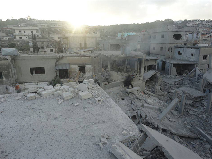 آثار الدمار الذي طال قلعة الحصن جراء قصف قوات النظام في معركة طويلة (الجزيرة)