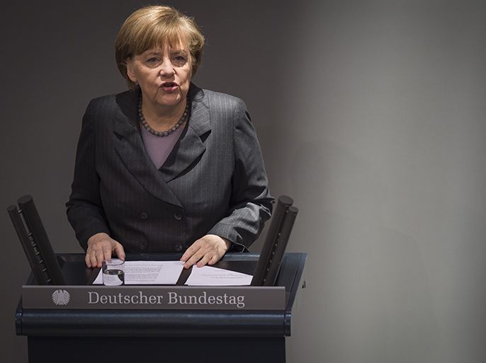 German Chancellor Angela Merkel lays out her governments policy on Ukraine by addressing delegates at the Bundestag, Germany's lower house of parliament in Berlin on March 13, 2014. AFP