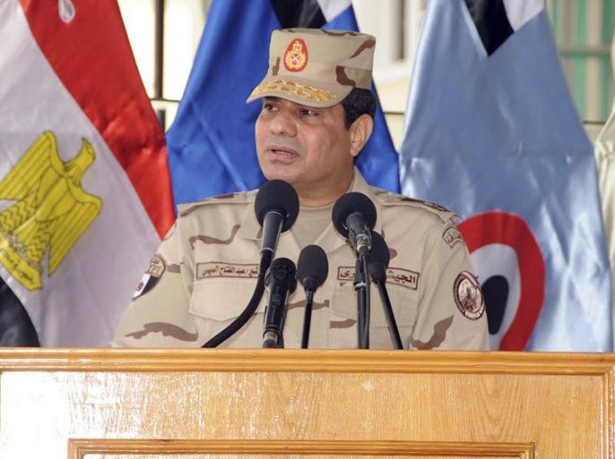 Egypt's army chief Field Marshal Abdel Fattah al-Sisi speaks during a ceremony to mark the end of the basic military training preparation period for college students and military academics at the military college in Cairo, in this March 4, 2014 handout provided by Egypt's Ministry of Defence. Sisi has sent the clearest signal yet that he will run for president, saying he cannot ignore the demands of the "majority", the state news agency MENA reported on Tuesday. REUTERS/Ministry of Defence/Handout via Reuters (EGYPT - Tags: POLITICS MILITARY TPX IMAGES OF THE DAY) ATTENTION EDITORS � THIS IMAGE WAS PROVIDED BY A THIRD PARTY. NO SALES. NO ARCHIVES. FOR EDITORIAL USE ONLY. NOT FOR SALE FOR MARKETING OR ADVERTISING CAMPAIGNS. THIS PICTURE IS DISTRIBUTED EXACTLY AS RECEIVED BY REUTERS, AS A SERVICE TO CLIENTS