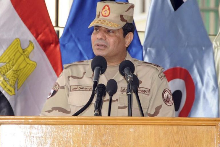 Egypt's army chief Field Marshal Abdel Fattah al-Sisi speaks during a ceremony to mark the end of the basic military training preparation period for college students and military academics at the military college in Cairo, in this March 4, 2014 handout provided by Egypt's Ministry of Defence. Sisi has sent the clearest signal yet that he will run for president, saying he cannot ignore the demands of the "majority", the state news agency MENA reported on Tuesday. REUTERS/Ministry of Defence/Handout via Reuters (EGYPT - Tags: POLITICS MILITARY TPX IMAGES OF THE DAY) ATTENTION EDITORS � THIS IMAGE WAS PROVIDED BY A THIRD PARTY. NO SALES. NO ARCHIVES. FOR EDITORIAL USE ONLY. NOT FOR SALE FOR MARKETING OR ADVERTISING CAMPAIGNS. THIS PICTURE IS DISTRIBUTED EXACTLY AS RECEIVED BY REUTERS, AS A SERVICE TO CLIENTS