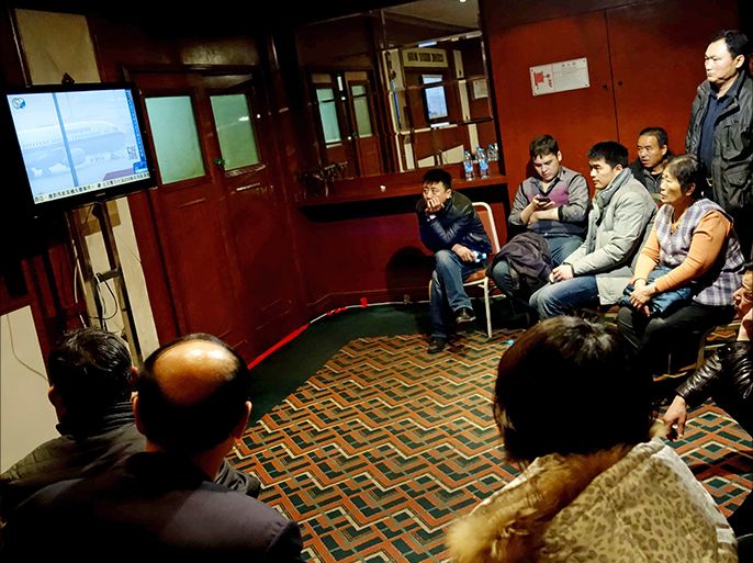 epa04118813 Relatives of the passengers on the missing Malaysia Airlines plane watch TV news in a hotel in Beijing, China 10 March 2014. Malaysia aviation authorities say the search for the missing jet will not stop until the aircraft is located. 'There is no time frame in the search operations,' Rahman said. The search for Malaysia Airlines flight MH370, which went missing on 08 March 2014 with 239 people on board, has brought together nearly 100 vessels and aircraft from eight countries in Asia and the Pacific. The assistance poured in after Malaysia sought help in locating the Boeing 777-200 that disappeared en route from Kuala Lumpur to Beijing. EPA/LAO CAI CHINA OUT