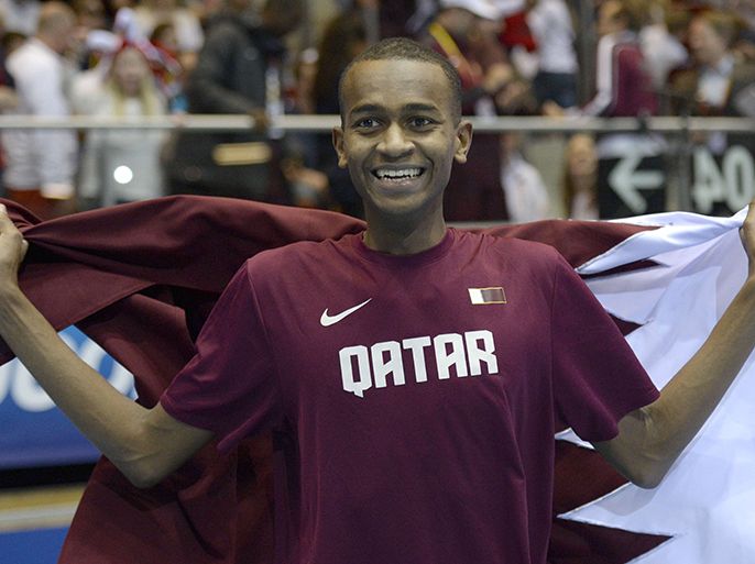 Qatar's Mutaz Essa Barshim celebrates winning in the men High Jump Final event at the IAAF World Indoor Athletics Championships in the Ergo Arena in the Polish coastal town of Sopot, on March 9, 2014. AFP