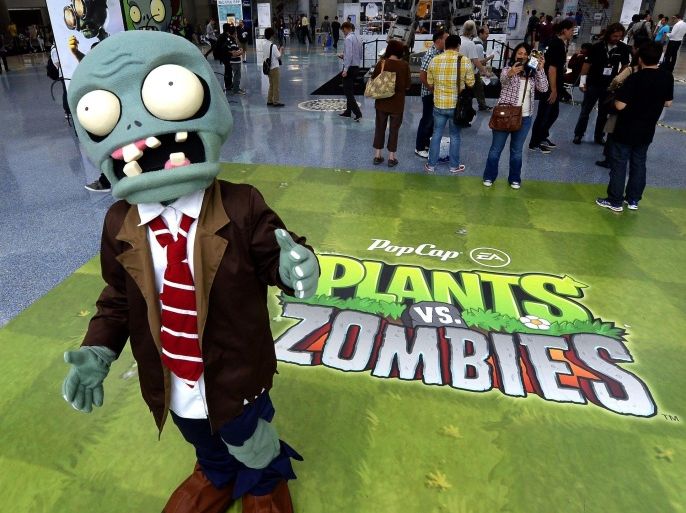 A person in a zombie outfit publicizes the new Plants vs Zombies game at the E3 (Electronic Entertainment Expo) in Los Angeles, California, USA, 11 June 2013. The E3 expo introduces new games and gaming devices and is an anticipated annual event among gaming enthusiasts and marketers.