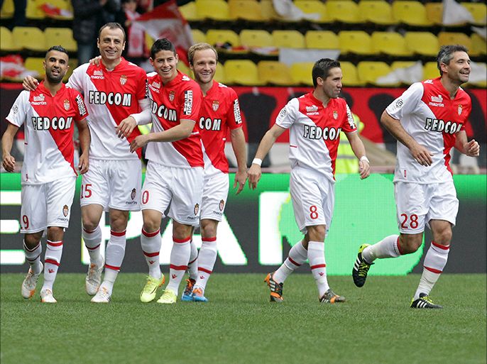 Monaco's forward Dimitar Berbatov (2nd-L) celebrates with teammates after scoring a goal during the French L1 football match between Monaco (ASM) and Nice (OGCN) at the Louis II Stadium in Monaco on April 20, 2014. AFP PHOTO / JEAN CHRISTOPHE MAGNENET