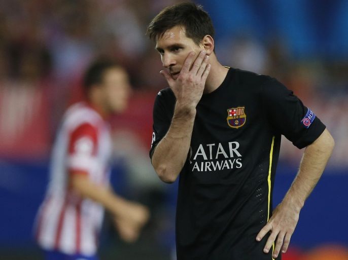 Barcelona's Lionel Messi from Argentina gestures during the Champions League quarterfinal second leg soccer match between Atletico Madrid and FC Barcelona at the Vicente Calderon stadium in Madrid, Spain, Wednesday, April 9, 2014. (AP Photo/Andres Kudacki)