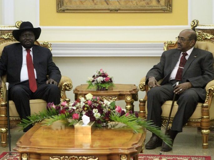 President of South Sudan, Salva Kiir (L) meets with his Sudanese counterpart Omar al-Bashir in Khartoum on April 5, 2014. Kiir arrived in Khartoum for an official visit to discuss the situation in the war-torn South, whose oil flows are economically vital to both nations. AFP PHOTO / ASHRAF SHAZLY