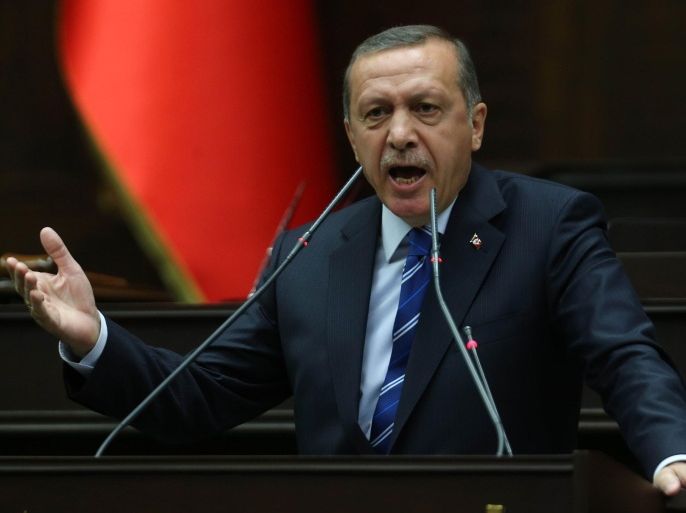 Turkey's Prime minister Recep Tayyip Erdogan delivers a speech to AK Party's (AKP) Members of Parliament during a meeting at the Turkish parliament in Ankara on April 29, 2014. AFP PHOTO/ADEM ALTAN