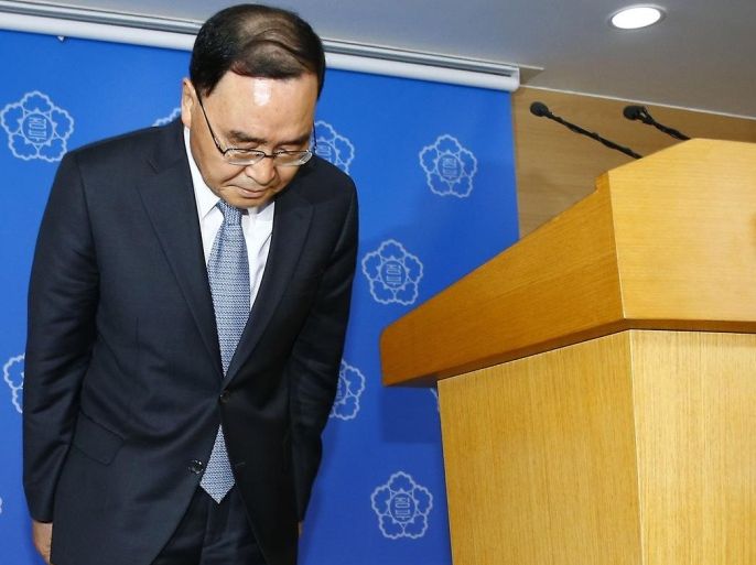 South Korean Prime Minister Chung Hong-won bows to the nation after offering his resignation at the Central Government Complex in Seoul, South Korea, Sunday, April 27, 2014. Chung offered to resign Sunday over the government's handling of a deadly ferry sinking, blaming "deep-rooted evils" and societal irregularities for a tragedy that has left more than 300 people dead or missing and led to widespread shame, fury and finger-pointing. (AP Photo/Yonhap) KOREA OUT