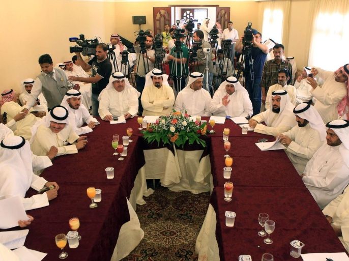 Members of the Opposition Coalition take part in a press conference about the 'national political reform programme' that was launched by the coalition on April 12, 2014 in Kuwait city. Kuwait opposition called for wide democratic reforms including a Western-style party system that would limit massive powers enjoyed by the oil-rich ruling family. AFP PHOTO / YASSER AL-ZAYYAT