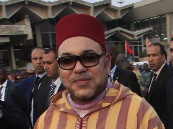 King Mohammed VI of Morocco is welcomed by traditional Ivorian chiefs as he arrives at the Felix Houphouet Boigny international airport in Abidjan February 23, 2014. King Mohammed VI is on a four day visit to the Ivory Coast. REUTERS/Thierry Gouegnon (IVORY COAST - Tags: POLITICS ROYALS)