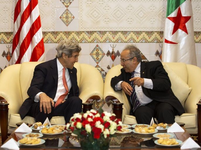 U.S. Secretary of State John Kerry, left, attends a tea ceremony with Ramtane Lamamra, Algerian Minister of Foreign Affairs, on arrival in Algiers, Algeria Wednesday, April 2, 2014, where he will participate in a U.S.-Algeria strategic dialogue. (AP Photo/Jacquelyn Martin, Pool)