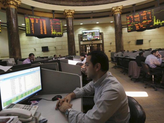 A trader watches his monitor at the Egyptian stock exchange in Cairo April 1, 2014. Egypt's Central Bank said on Tuesday it had covered the entire backlog of dollars owed to foreign investors seeking to repatriate funds from the country but did not say how much money was involved. In a push to restore confidence in the economy, authorities opened a repatriation scheme in March 2013 guaranteeing foreign investors in Egyptian stock and government bond markets access to dollars despite the severe shortages of the U.S. currency. REUTERS/Mohamed Abd El Ghany (EGYPT - Tags: BUSINESS POLITICS)