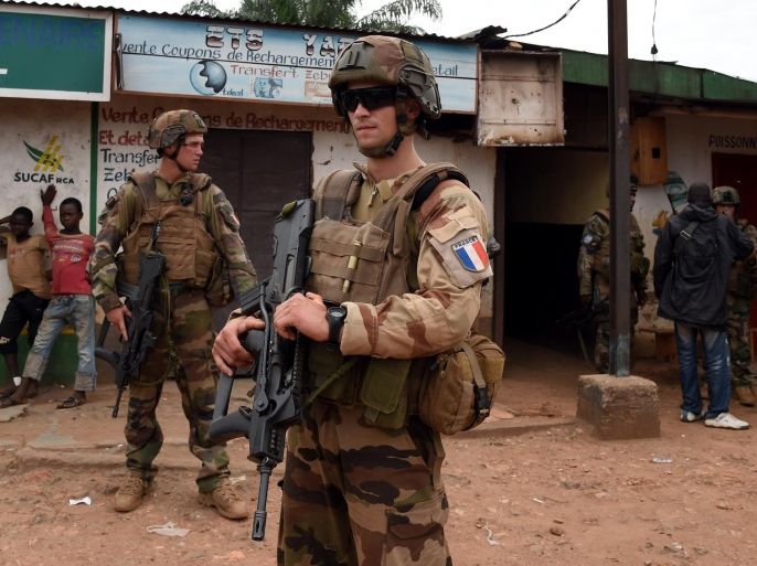 French soldiers, part of the Sangaris operation, patrol near the mosque where muslims are gathered in the PK12 neighbourhood in Bangui, on April 24, 2014. AFP PHOTO / ISSOUF SANOGO