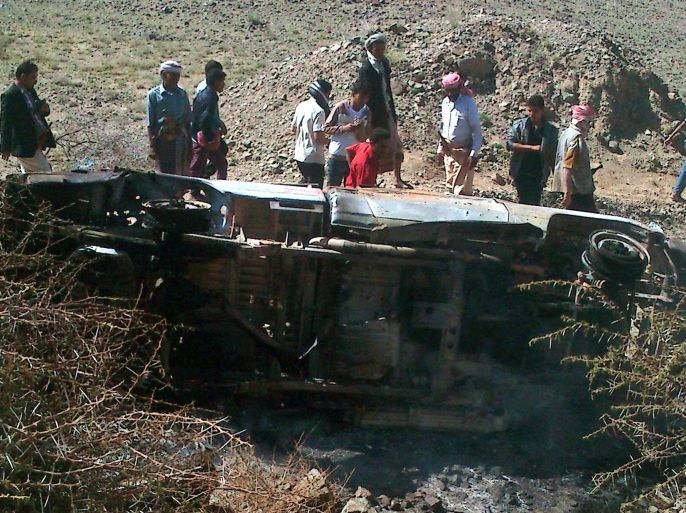 Yemenis stand around a pickup truck after it was allegedly hit by a US drone in the al-Bayda province, Yemen, 19 April 2014. At least 14 people, including 12 al-Qaeda suspects, were killed Saturday in a drone raid in the central Yemeni province of Bayda, Yemeni media reports said. Five others in a separate vehicle were wounded in the strike, which targeted a vehicle carrying 12 militants with suspected links to al-Qaeda, according to independent Yemeni news website Mareb Press. Al-Bayda, located around 190 kilometres south-east of the capital Sana'a, is believed to be a stronghold of al-Qaeda-linked extremists.