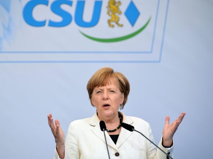 German Chancellor Angela Merkel speaks during an election campaign event outside of St. Mary's Chuch in Hof, Germany, 21 May 2014. The EU elections on 22-25 May 2014 will produce a new European Parliament, whose 751 members will help set laws in the European Union for five years to come.