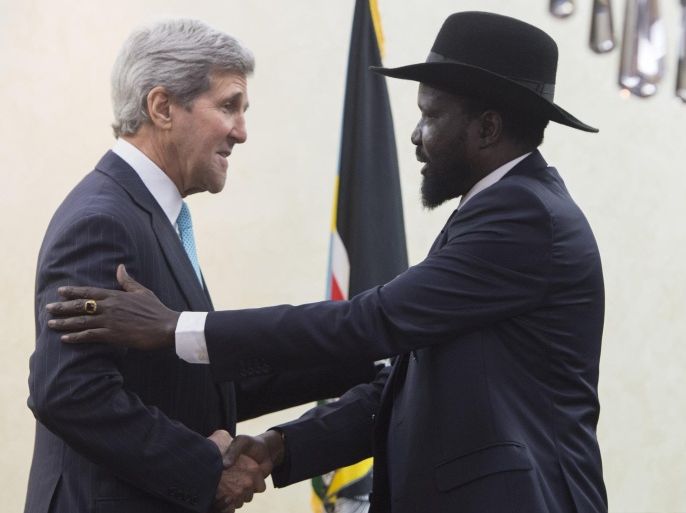 South Sudan's President Salva Kiir, right, greets U.S. Secretary of State John Kerry at the President's Office in Juba, South Sudan, Friday, May 2, 2014. Kerry is urging South Sudan's warring government and rebel leaders to uphold a monthslong promise to embrace a cease-fire or risk the specter of genocide through continued ethnic killings. (AP Photo/Saul Loeb, Pool)