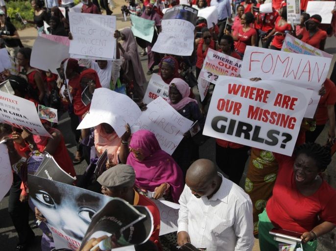 Women attend a mass-demonstration calling on the government to increase efforts to rescue the hundreds of missing kidnapped school girls of a government secondary school Chibok, in Lagos, Nigeria, Monday, May 5, 2014. Leader of a protest march Saratu Angus Ndirpaya of Chibok town, said that Nigeria's First Lady ordered her and another protest leader to be arrested Monday, and expressed doubts there was any kidnapping and accused them of belonging to the Islamic insurgent group blamed for the abductions. Police say more than 300 girls and young women were abducted mid-April from Chibok Government Girls Secondary School, of whom some 53 girls are known to have escaped. (AP Photo/ Sunday Alamba)