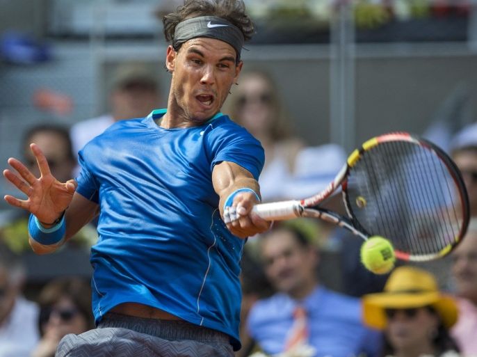 Rafael Nadal from Spain returns the ball during a Madrid Open tennis tournament semifinal match against Roberto Bautista Agut from Spain in Madrid, Spain, Saturday, May 10, 2014. (AP Photo/Andres Kudacki)