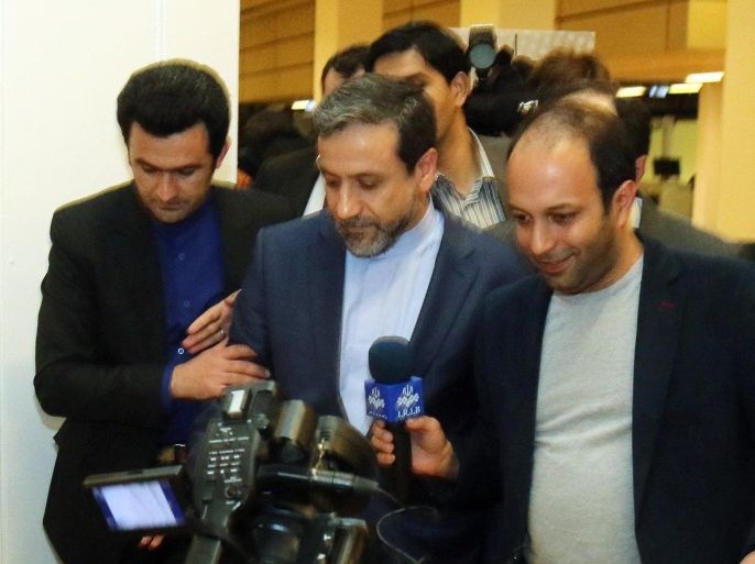Iran's deputy Foreign Minister Abbas Araghchi, center, arrives for a press briefing for Iranian journalists after the closed-door nuclear talks at the International Center in Vienna, Austria, Friday, May 16, 2014. Talks between Iran and six world powers hit a major snag Friday over the future size of a nuclear program that Tehran says it needs to expand to fuel atomic reactors, but which the U.S. fears could be used to make nuclear weapons. (AP Photo/Ronald Zak)