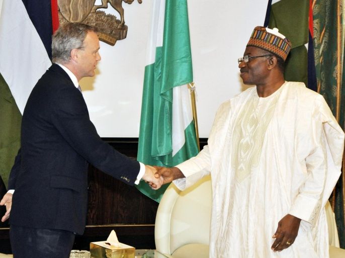 British Foreign Office Minister Mark Simmonds, left, shakes hands with Nigeria President Goodluck Jonathan, right, before a meeting at the state house in Abuja, Nigeria, Wednesday, May 14, 2014. A Nigerian government official said "all options are open" in efforts to rescue almost 300 abducted schoolgirls from their captors as US reconnaissance aircraft started flying over this West African country in a search effort. Boko Haram, the militant group that kidnapped the girls last month from a school in Borno state, had released a video yesterday purporting to show some of the girls. A civic leader said representatives of the missing girls' families were set to view the video as a group later today to see if some of the girls can be identified. (AP Photo)