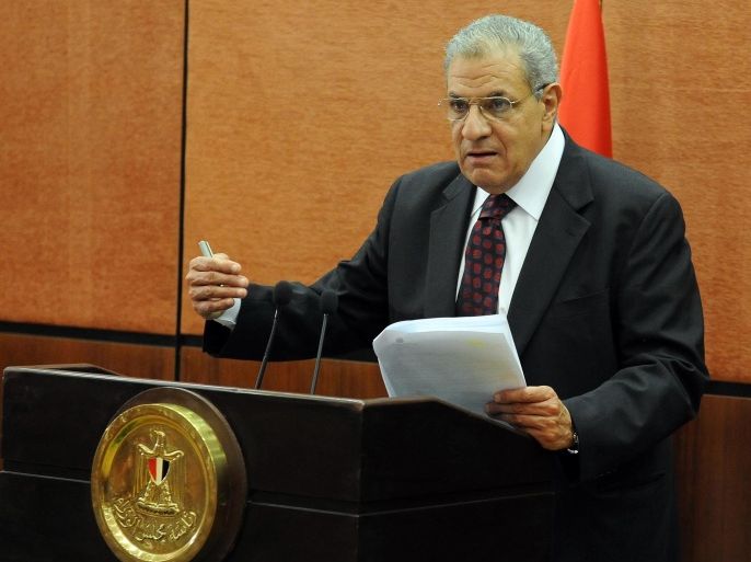 (FILES) A file picture taken on January 16, 2014 shows Egypt's then housing minister Ibrahim Mahlab speaking during a press conference in Cairo on January 16, 2014. Outgoing housing minister Mahlab was appointed on February 25, 2014 as Egypt's new prime minister after the resignation of the cabinet installed by the military following last year's overthrow of Islamist president Mohamed Morsi. AFP PHOTO / STR