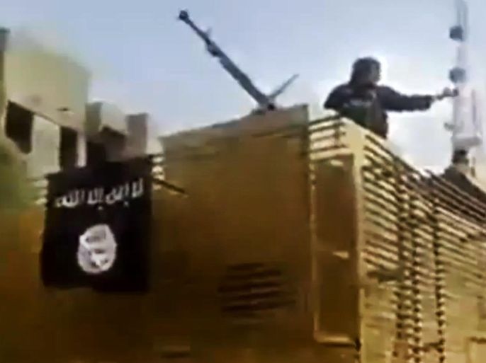 In this Tuesday, June 17, 2014 image taken from video uploaded to a militant social media account, which has been authenticated based on its contents and other AP reporting, al-Qaida-inspired Islamic State of Iraq and the Levant militants arrive to the country’s largest oil refinery in Beiji, some 250 kilometers (155 miles) north of the capital, Baghdad, Iraq. Iraqi security forces battled insurgents targeting the country’s main oil refinery and said they regained partial control of a city near the Syrian border Wednesday, trying to blunt a weeklong offensive by Sunni militants who diplomats fear may have also seized some 100 foreign workers. (AP Photo via militant video)